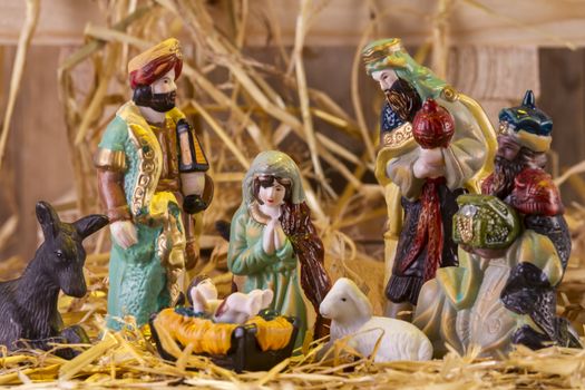 Christmas Manger scene with figurines including Jesus, Mary and magi. Focus on Mary!

