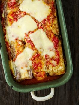 close up of rustic traditional italian eggplant parmesan