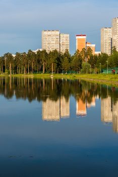 House reflected in the lake at sunset light in Zelenograd district of Moscow, Russia