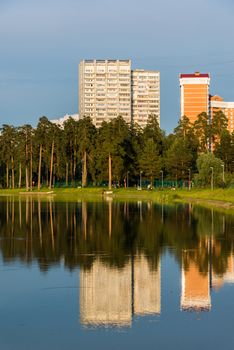 House reflected in the lake at sunset light in Zelenograd district of Moscow, Russia