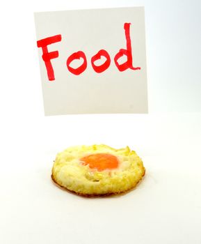 Mot Food written in red letters with an egg on the flat on a white background