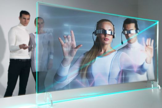 People with remote control switcth futuristic hologram