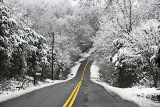 Hilly country roads,covered with black ice & snow