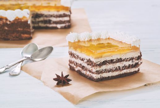 Banana cake with jelly on baking paper on table on light background