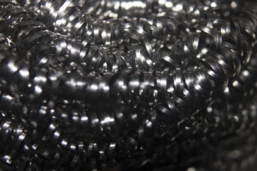 Close-up of a scouring pad stainless steel silver photo