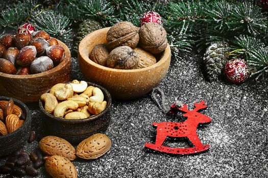 Almond,hazelnut and walnut on the background of Christmas tree