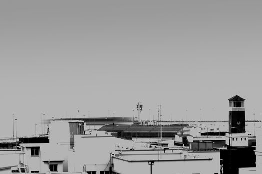 Void of colour, the Campanile Tower in Port Elizabeth with the harbor in the background.