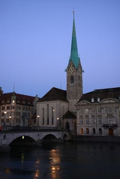 old building in zurich by a river