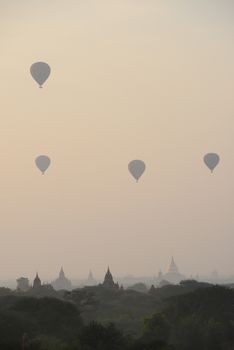 pagoda and hot air balloon in bagan myanmar in the morning