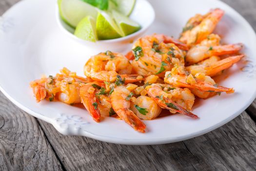 Fried Prawns served on the plate with lime