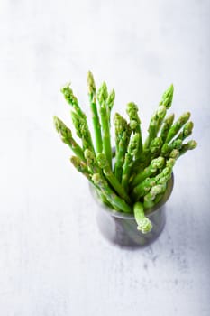 Bundle of fresh green asparagus on the table