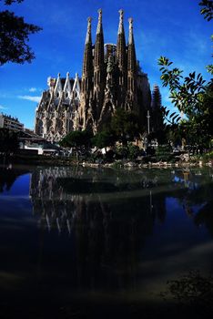 View and reflection of Sagrada Familia Basilica and Expiatory Church of the Holy Family