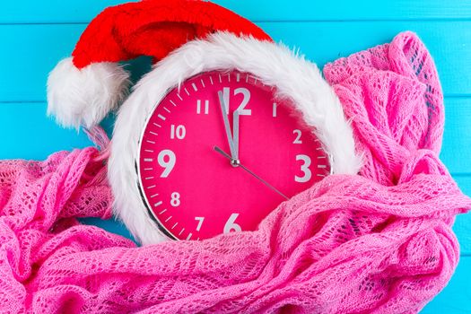 the pink clock with christmas santa hat