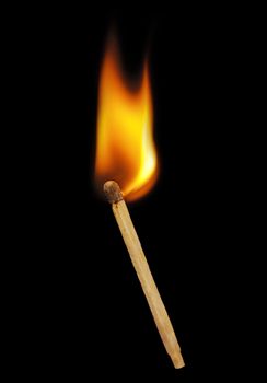 Burning match on a black background