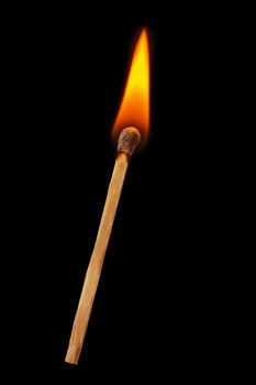 Burning match on a black background