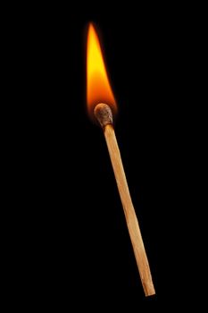 Burning match on a black background