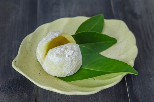 Daifuku Mochi Japanese dessert on dish over wooden background