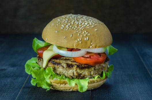 Closeup of home made burgers on wooden background