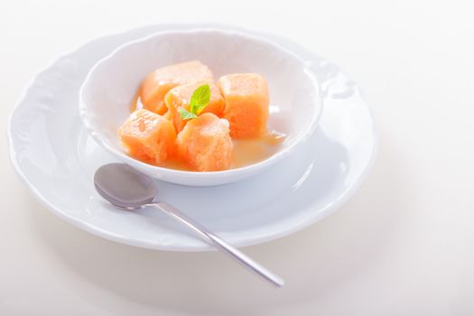 Apricot sorbet with mint served on the table