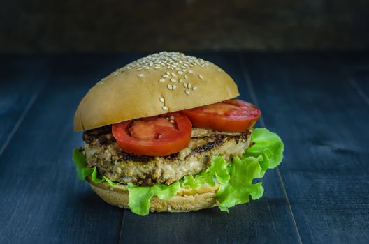 Closeup of home made burgers on wooden background