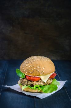 Closeup of home made burgers on wooden background