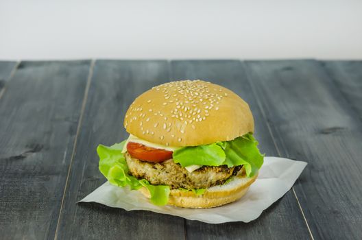 Closeup of home made burgers on wooden background