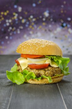 Closeup of home made burgers on wooden background