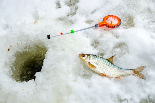 Ice fishing in the winter time in Russia