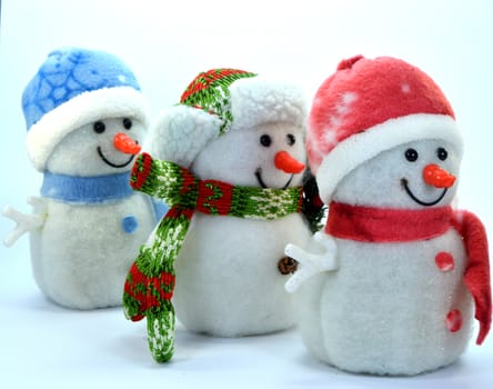 Trio of snowman in a row on a white background