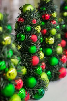 Christmas decorations on a Christmas tree. Small Christmas tree with toys