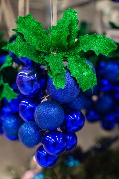 Christmas decorations on a Christmas tree. Christmas decorations like grapes