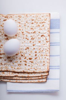 Matza and eggs for Jewish celebration passover.