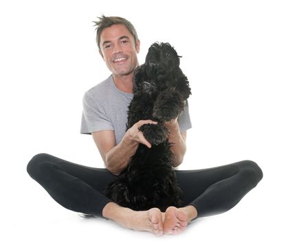 man and american cocker in front of white background