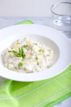 Risotto with Asparagus in a white plate.