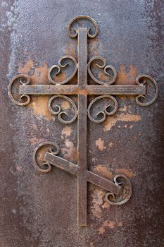 rusty iron cross . Putilov Church, an Orthodox Church in St. Petersburg , Russia
