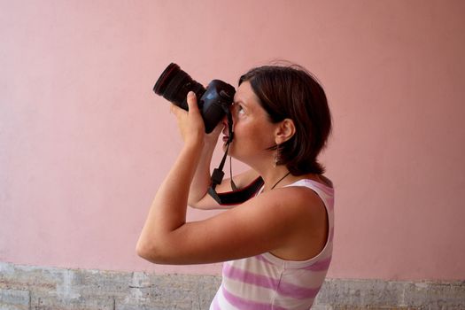 Photographer girl shooting images with copyspace area