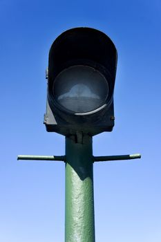 green street lamp post on blue sky background