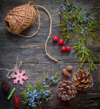 Christmas background with rope, branches, pine cones decoration