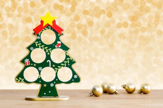 Christmas background. Christmas tree and golden balls with lights snow winter background. 