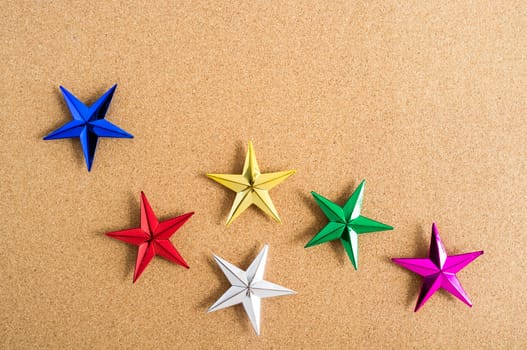 Christmas background. Colorful stars on cork board. Abstract background. 