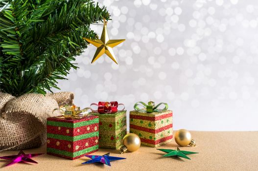 Christmas background. Christmas tree, golden balls and gift boxes. with snow lighting background.






Christmas background. Christmas tree, golden balls and gift boxes.