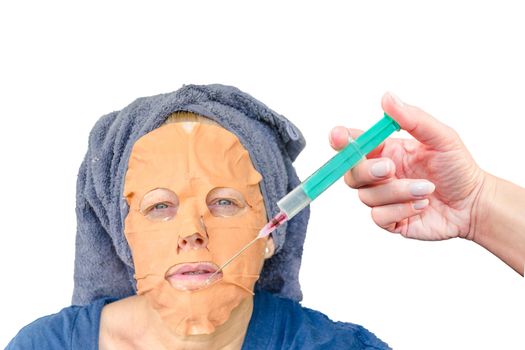 Close-up portrait of a cosmetic face mask and an injection with botulinum toxin in the female face lip zone.