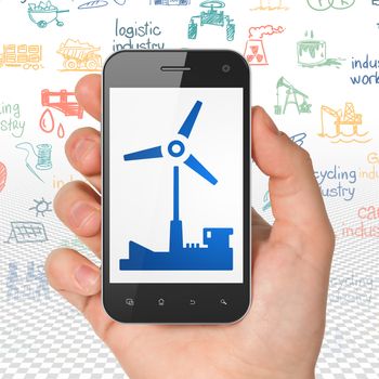 Industry concept: Hand Holding Smartphone with  blue Windmill icon on display,  Hand Drawn Industry Icons background, 3D rendering