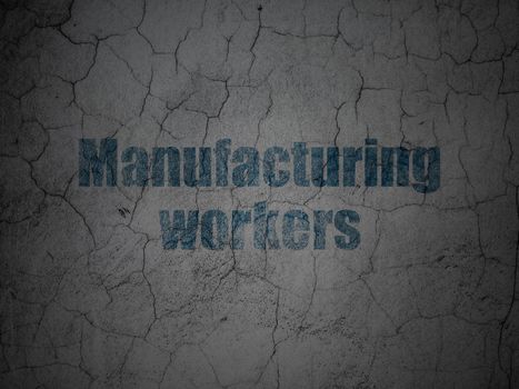 Manufacuring concept: Blue Manufacturing Workers on grunge textured concrete wall background