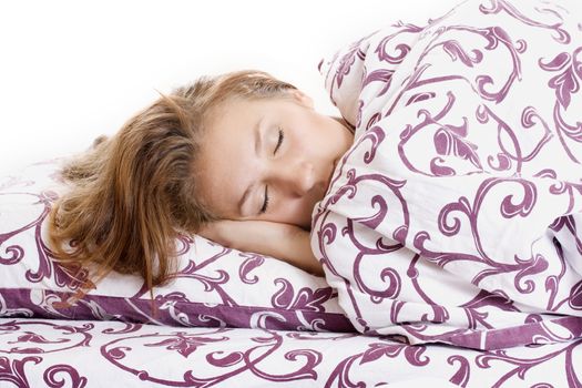 Young woman sleeping in bed in the morning.