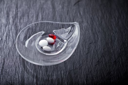 Pills and medecine on a stone plate