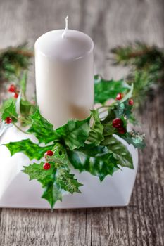 Christmas symbols including Candle on a wooden table