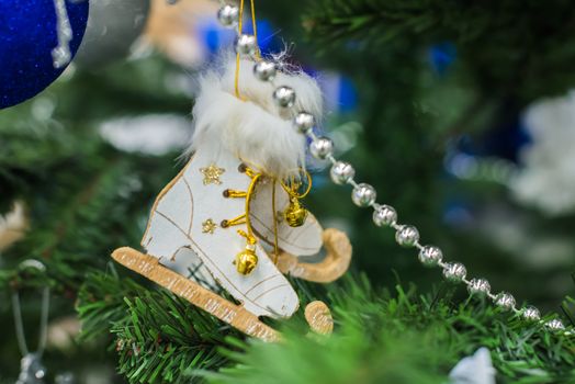 Christmas decorations on a Christmas tree. Christmas decorations like skates
