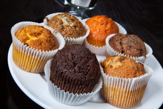 Different kinds of muffins on the kitchen table