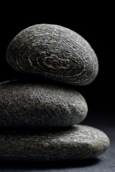 Pile of stones isolated on black background